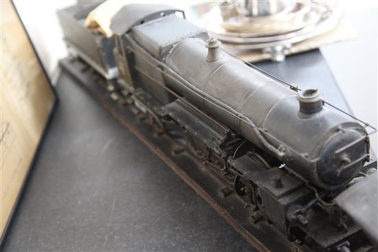 A scratchbuilt model of a 262 steam powered locomotive and tender,